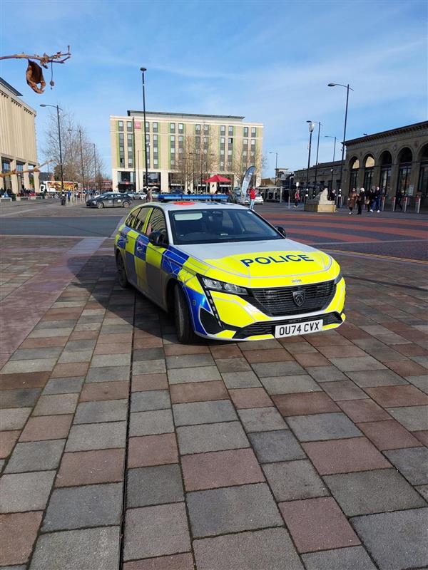 Police car on patrol at Station Square