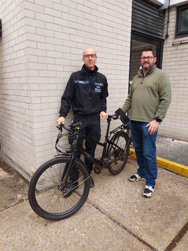 PC reuniting stolen bike with it's owner 