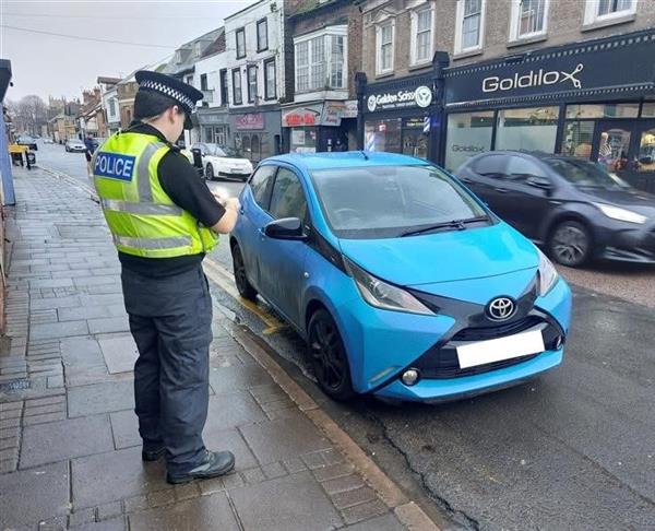 PC issuing parking tickets 