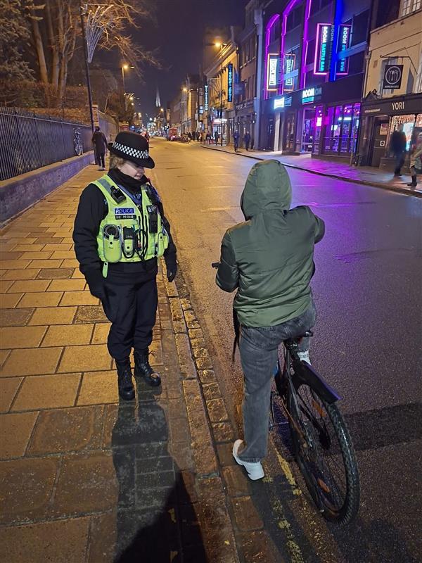 PC talking to cyclist 