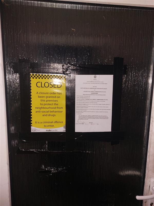 The front door of the property with closure notice attached