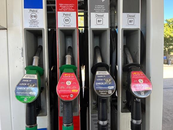 Four petrol and diesel pumps with two adverts with messaging for bicycle owners to 'Love it. Lock it' and to ‘Take Your Items With You’ to drivers and their passengers 