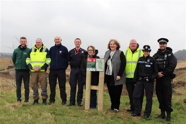 Representatives from the authorities stood with the Public Space Protection Order sign