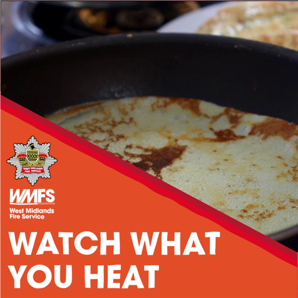 A pancake in a pan. Text below reads 'Watch what you heat'. The WMFS logo is above.