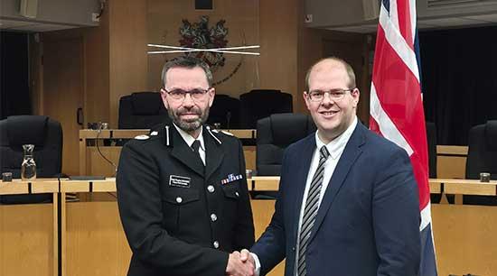 PCC shaking hands with new Chief Constable