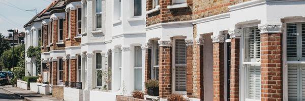 Image shows a street of Victorian terraced houses