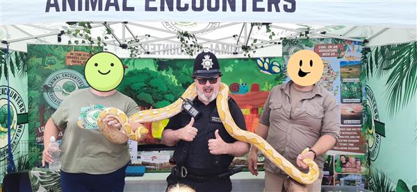 PC Manus with staff from Animal Encounters with Mango Python (no relation to Monty)