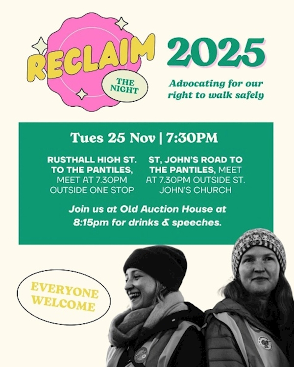 Two women standing in front of a poster
AI-generated content may be incorrect.