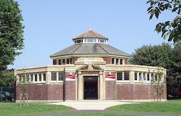 A circular building with a round roof
AI-generated content may be incorrect.