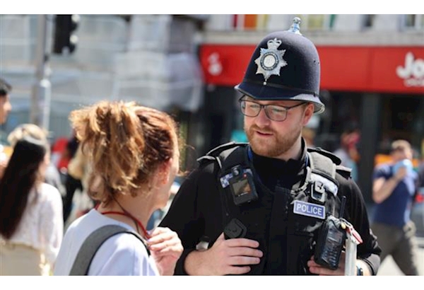 Police officer speaking to member of public in Nottingham City Centre