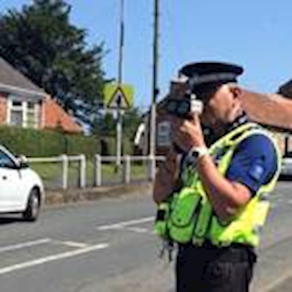 A person in a safety vest holding a camera
AI-generated content may be incorrect.