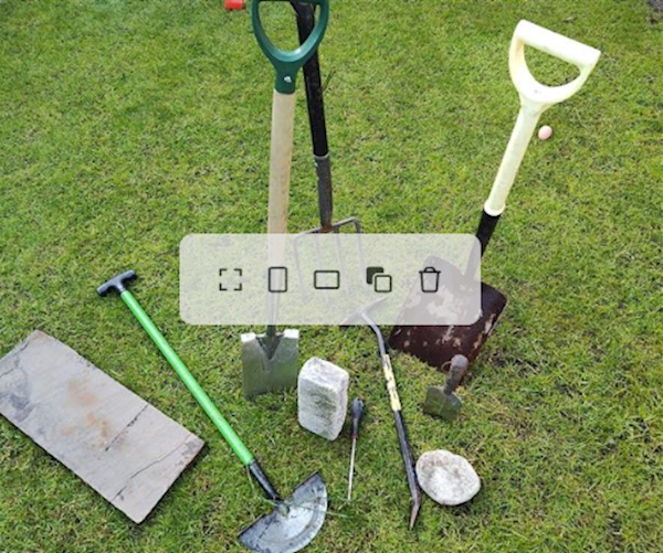 A group of garden tools on grass
AI-generated content may be incorrect.