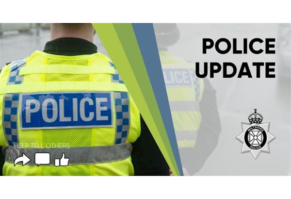 Police Update - high vis wearing officer, photographed from behind.