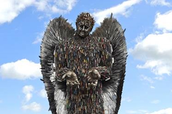 A statue of a person made of knives