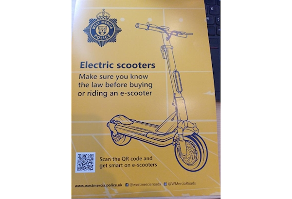 Picture shows a poster with an e-bike on it and a message saying "Make Sure You Know The Law"