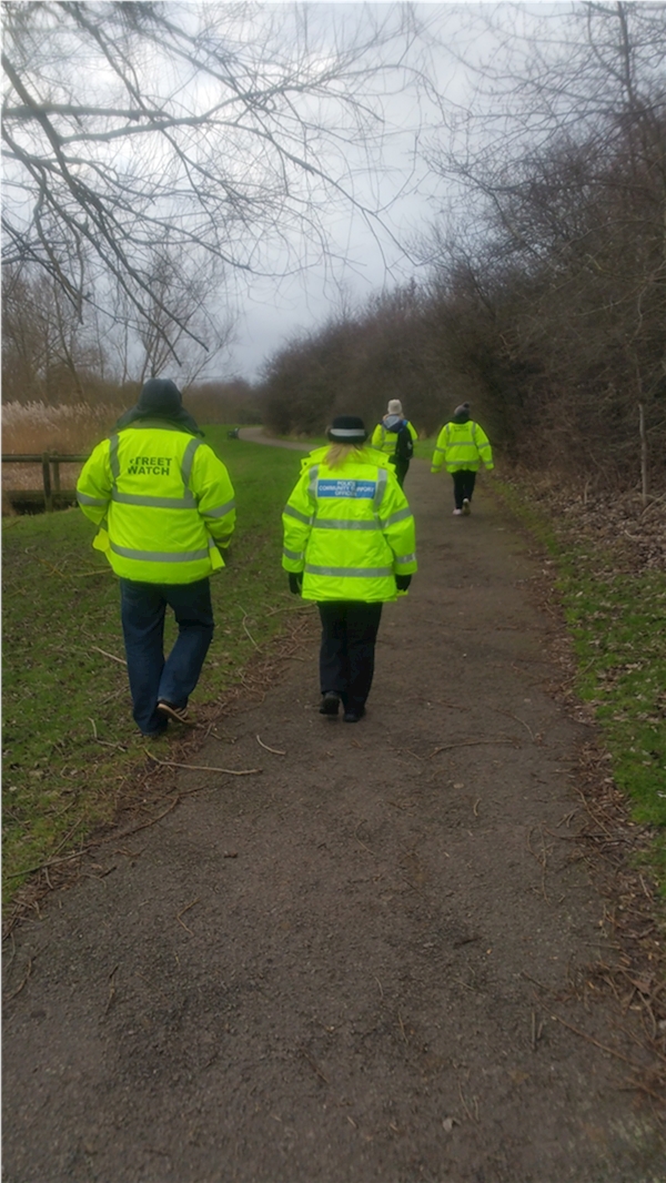 A group of people in bright yellow jackets walking on a path

AI-generated content may be incorrect.