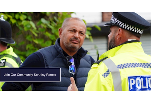 Image of Police and Crime Commissioner Gary Godden speaking with a police officer