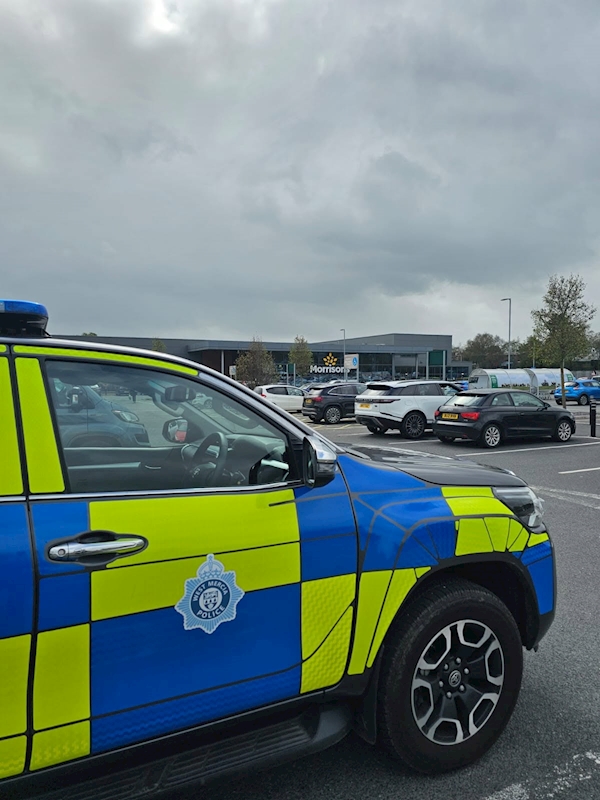 A police vehicle parked outside morrisons