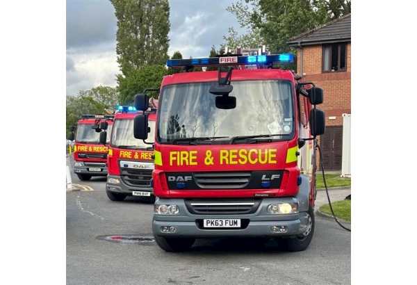 Three Lancashire fire engines on a drill yard