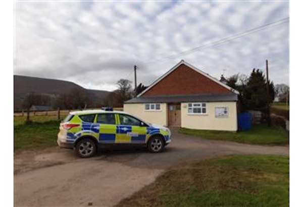 Police car parked in front of Longtown village hall