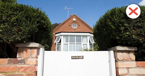 A gate in front of a house