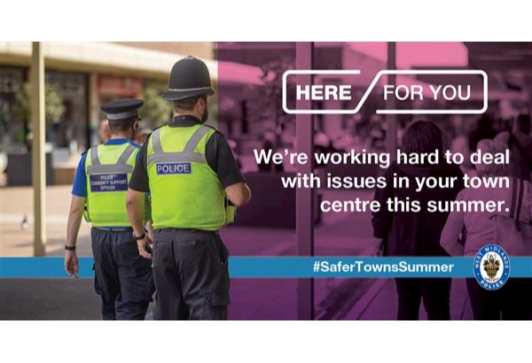 Two police officers walking through a town centre, with text stating they are working to deal with local issues.