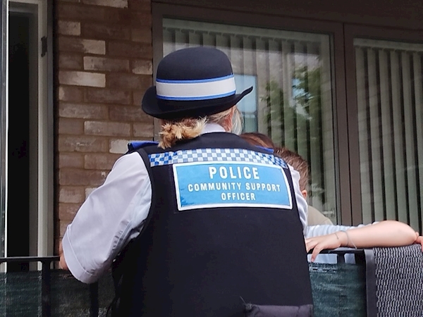 A police officer standing outside a building

AI-generated content may be incorrect.