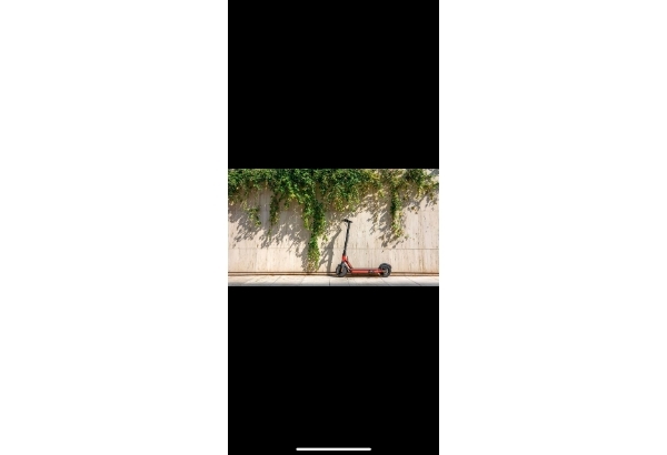 A scooter parked on a sidewalk

AI-generated content may be incorrect.