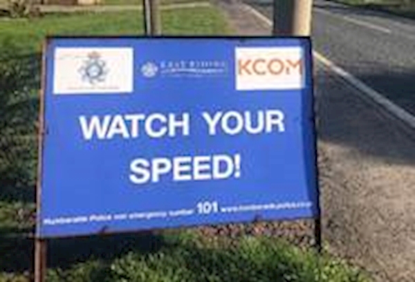 A blue sign on the side of a road
AI-generated content may be incorrect.