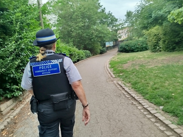 A person in a police uniform walking down a path

AI-generated content may be incorrect.