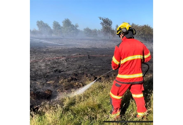 Firefighter tackling wildfire in Lancashire