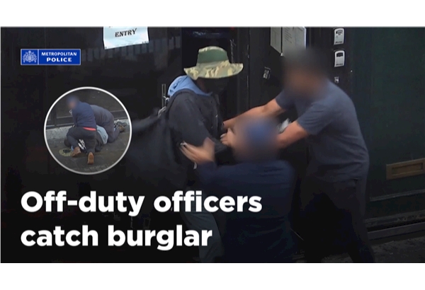 Two off-duty officers detained a burglar moments after he broke into a shop in Old Street