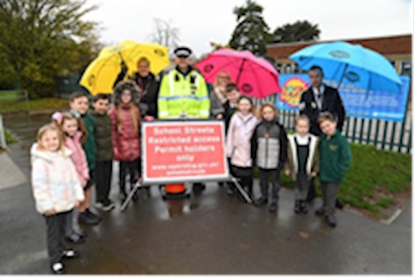 A group of people standing in front of a sign
AI-generated content may be incorrect.