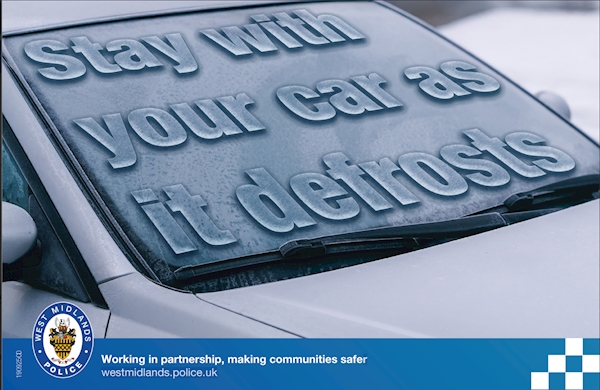 A car with a windshield covered in ice