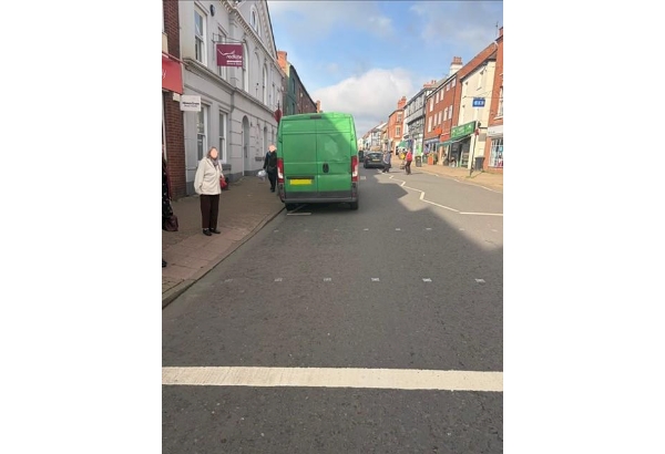 van parked on zig zag lines. 