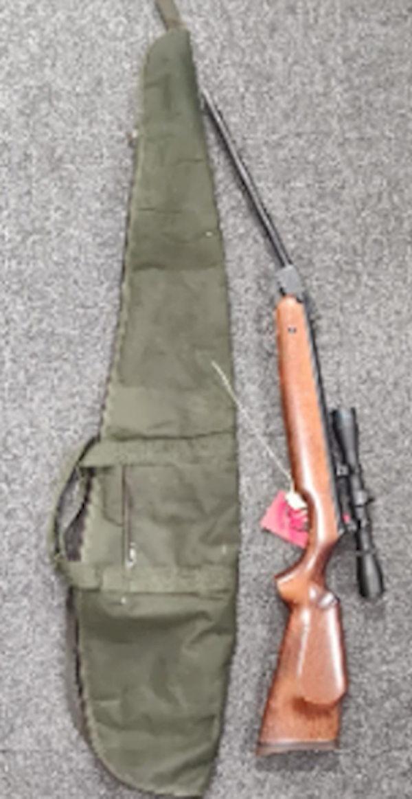 A rifle and a bag

AI-generated content may be incorrect.