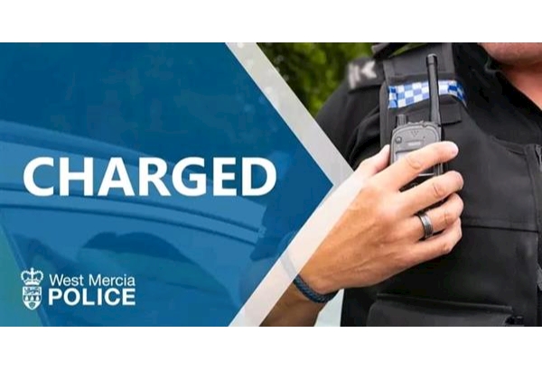 Image of Police Officer talking on his radio and the word "Charged"