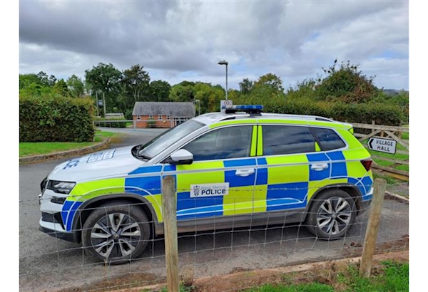 Police car parked in front of Cusop village hall