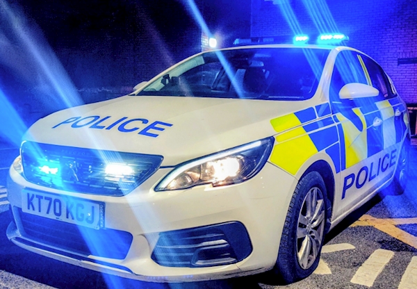 A police car with lights on

AI-generated content may be incorrect.