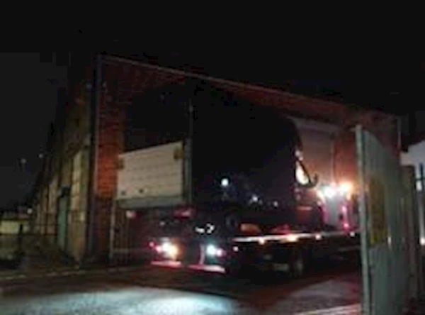 A truck on a flatbed trailer

AI-generated content may be incorrect.