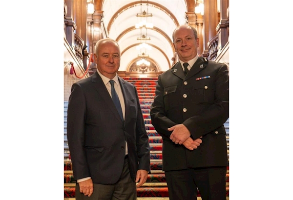 Commissioner Ben Adams standing next to David Gardner.