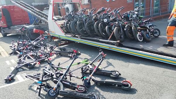 May be an image of 1 person, bicycle, scooter, segway, motorcycle and text