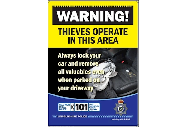 Poster with warning to lock vehicles and put valuables out of sight in vehicles when parked unattended