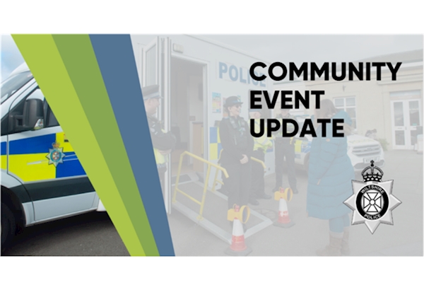 Community Event Update - high vis wearing officers, photographed by the side of a mobile police station, talking to a member of the public.