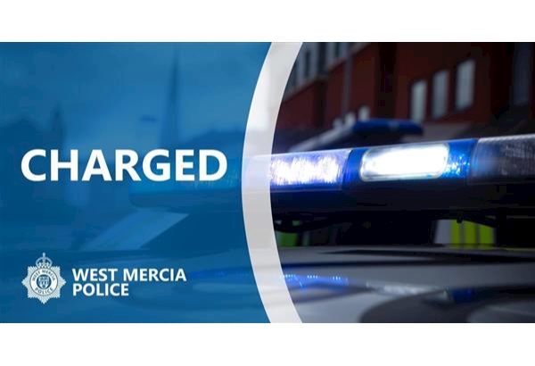 Charged - wording next to police car lights