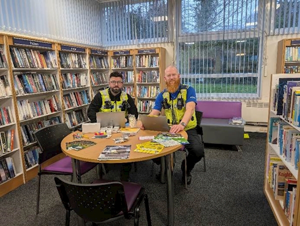 Two men sitting at a table in a library

AI-generated content may be incorrect.
