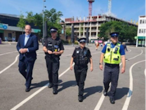 A group of police officers walking on a street

AI-generated content may be incorrect.